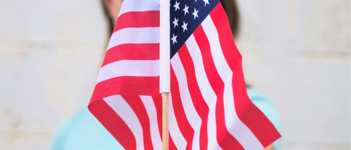 person holding USA Flag